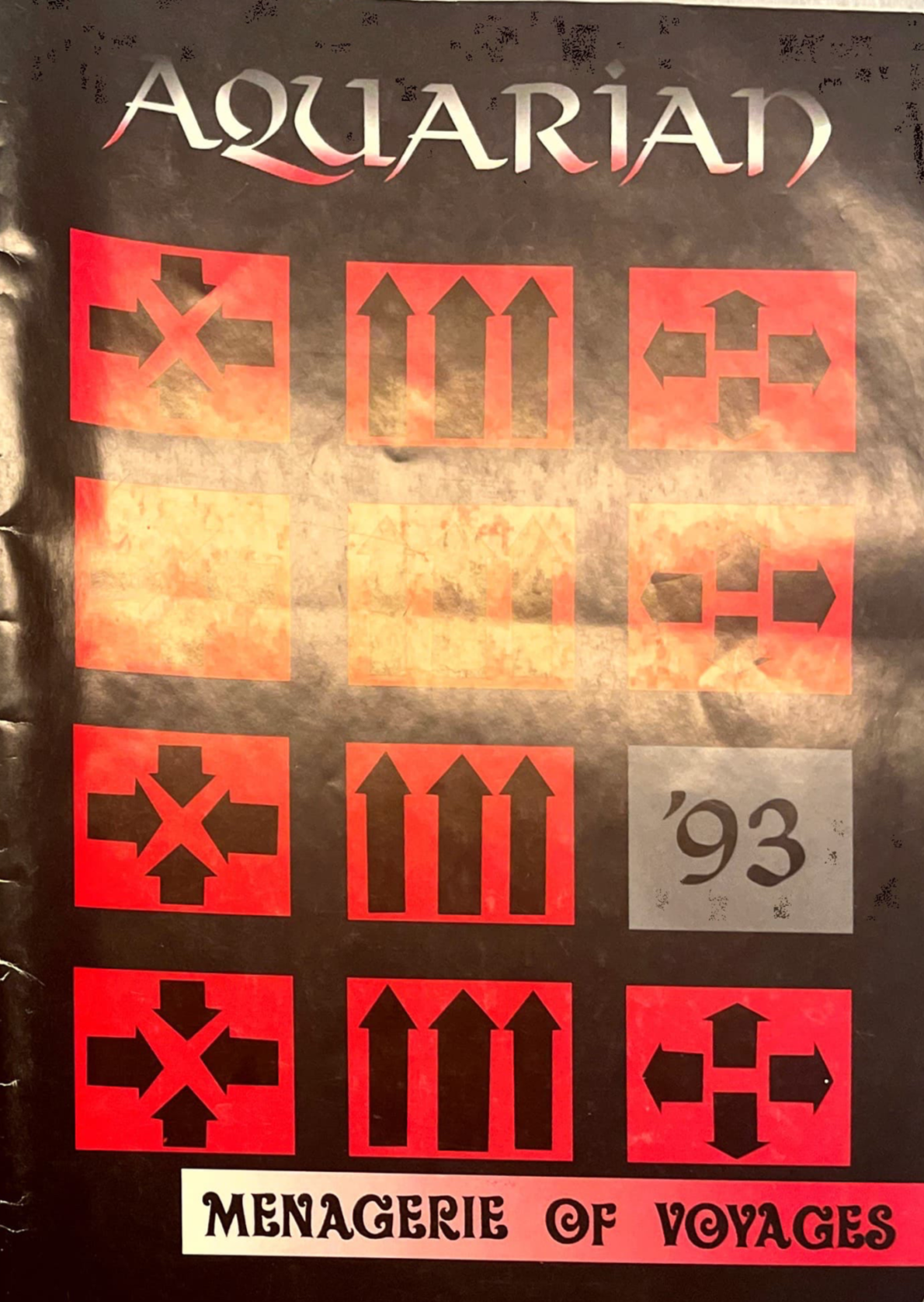 A black, grey, and red cover with various shapes and arrows in a pattern of squares, with the 1993 title Aquarian, menagerie of voyages