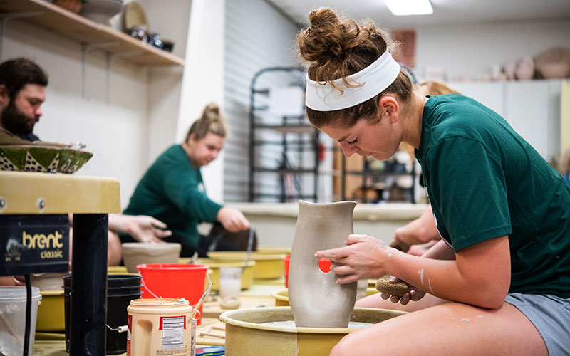 A student working in Ceramics class.