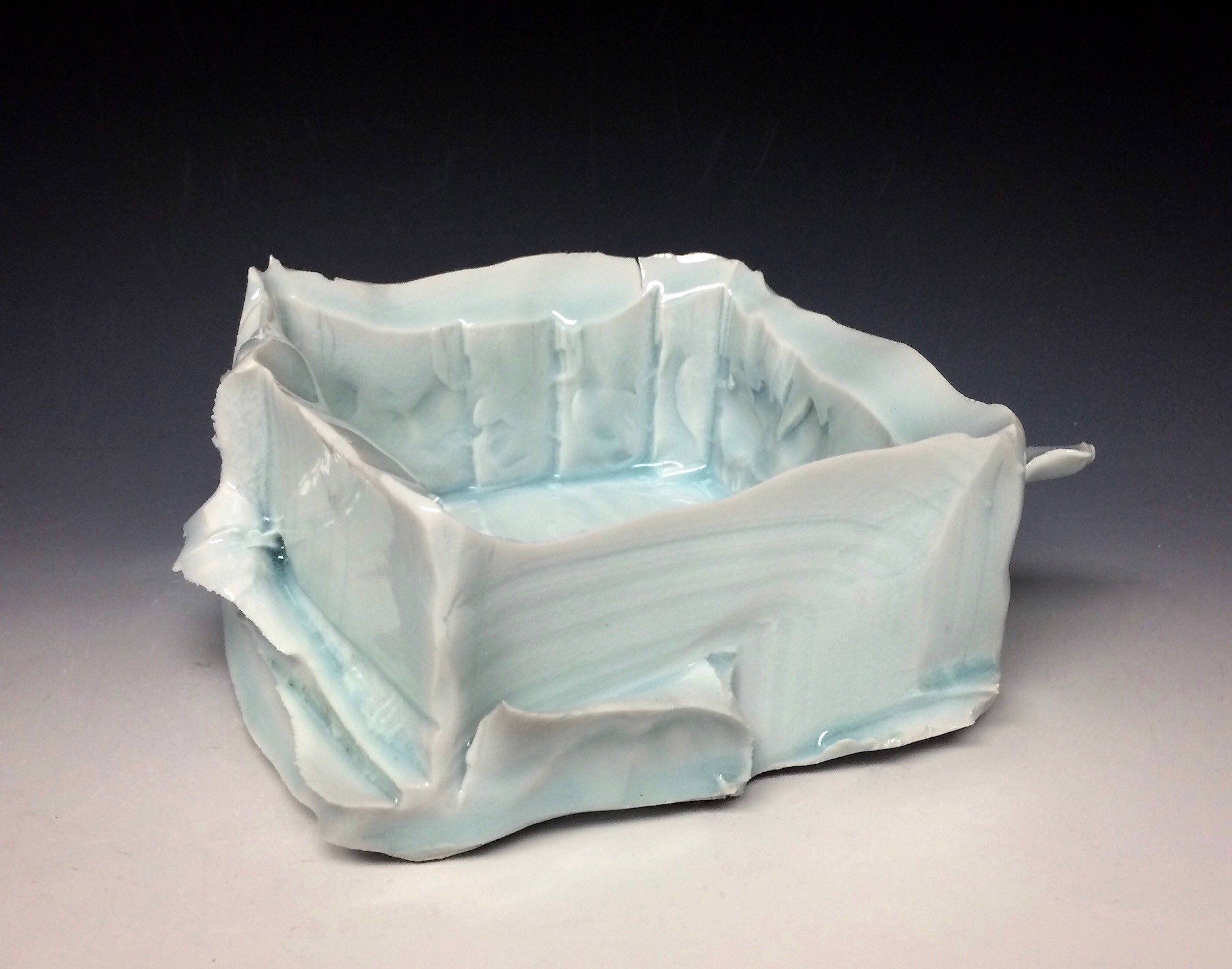 Ceramic sculpture of iceberg vessel by artist John Oles.