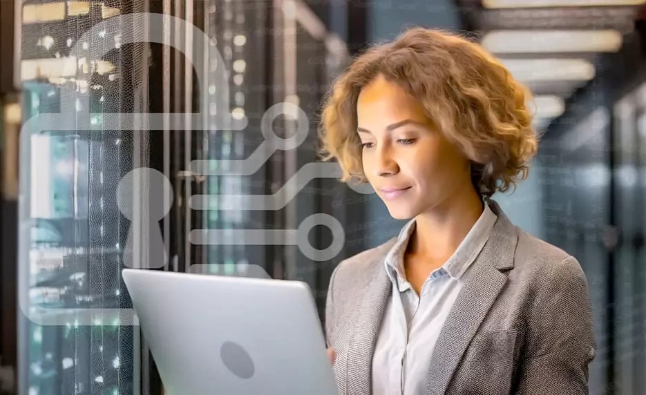 Businesswoman standing working on computer