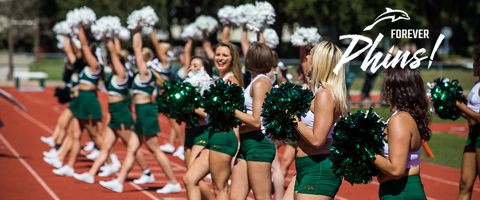 Photo of cheerleaders dressed in JU's green colors.