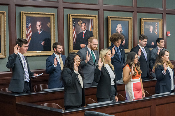 Students taking the oath of professionalism at the inaugural convocation.