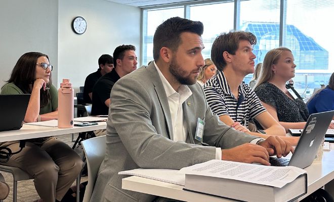 A group of students sitting at their desks during a class.