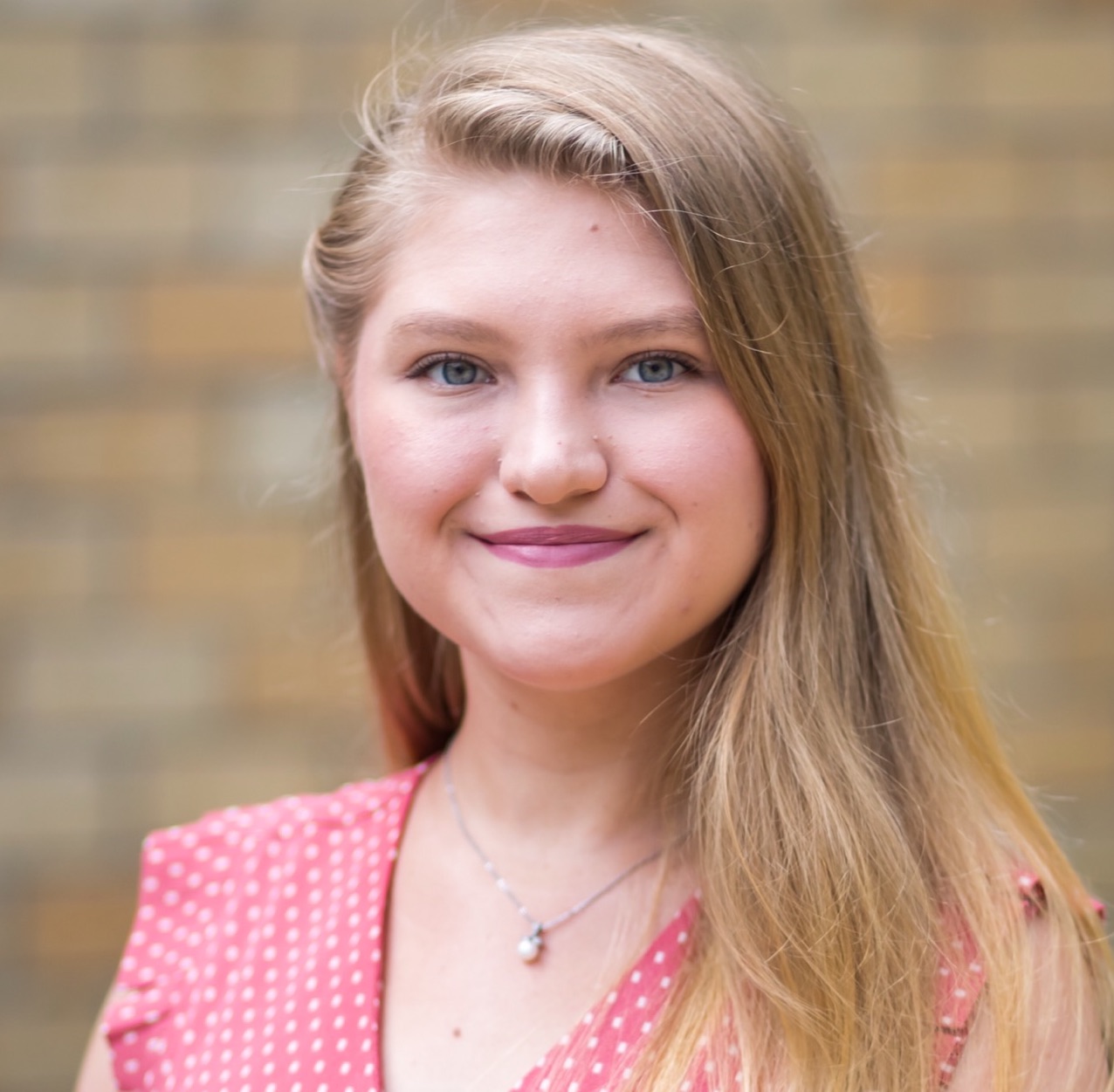 A female student smiling for a headshot photo.