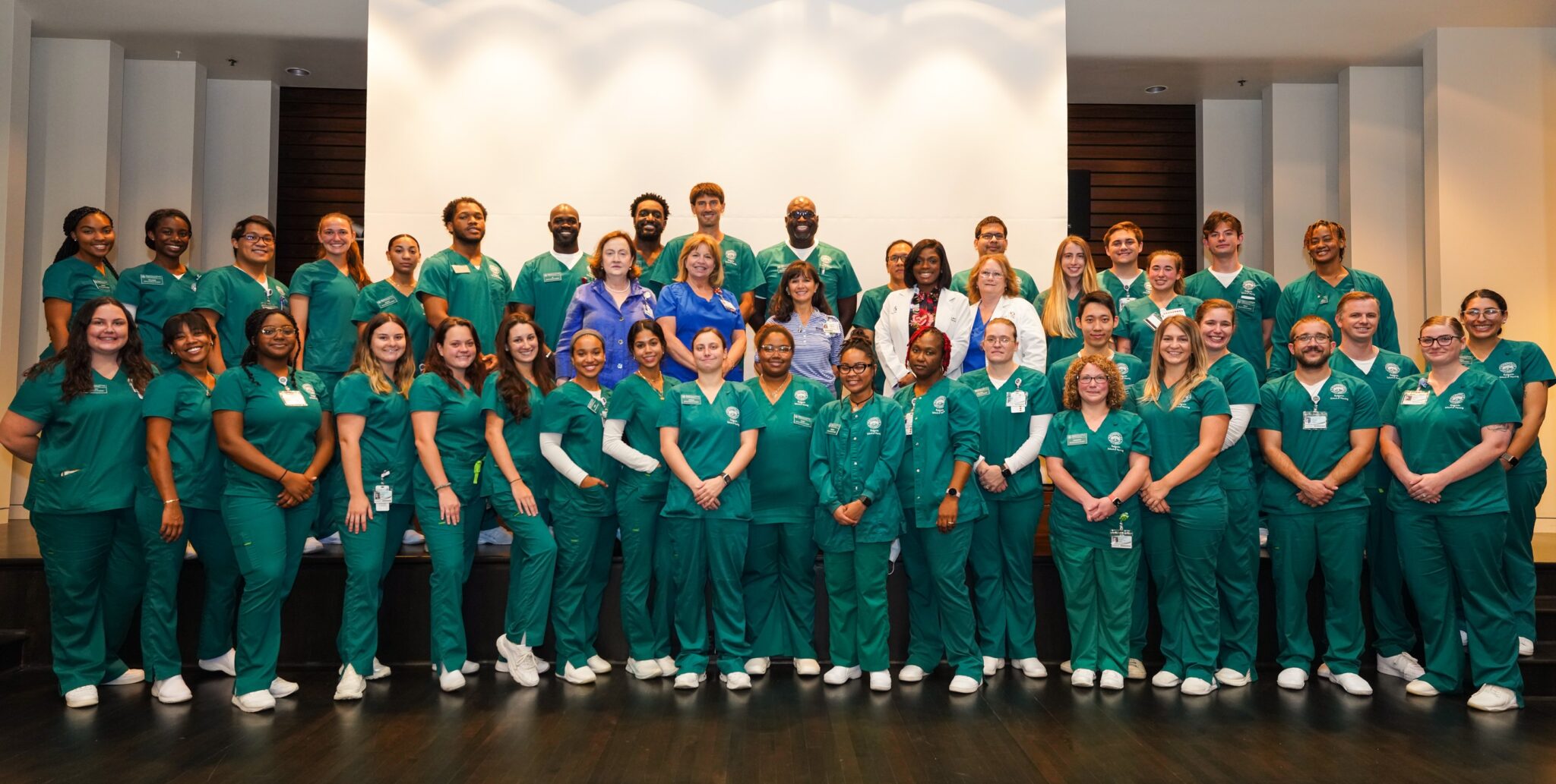 JU's ABSN class standing in a large group for a photo.