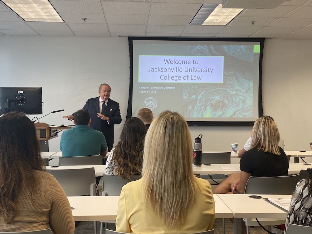 Dean Allard instructs students in a classroom.