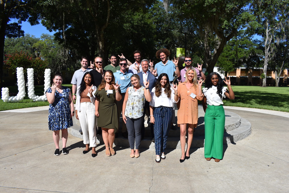 Group photo of law students at the Dolphin statues.