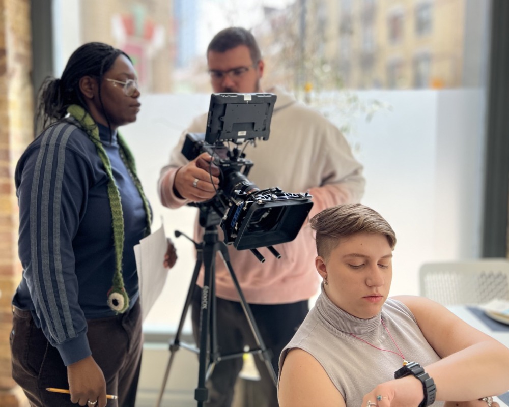 Film student James Martz frames a shot with the camera.