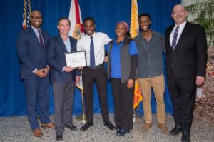 From left to right: Joe Peppers, Mayor Lenny Curry, Cyriac Adjevi-Neglokpe, his mother, brother Loic & Dean Tim Snyder