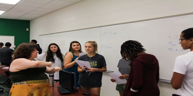 teacher teaching classroom of students