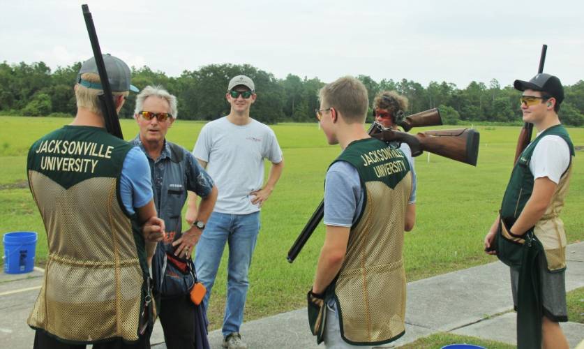 JU Students preparing to shoot listen to Coach