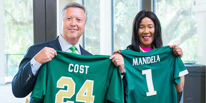 Dr. Makaziwe Mandela and President Tim Cost '81 exchange jerseys