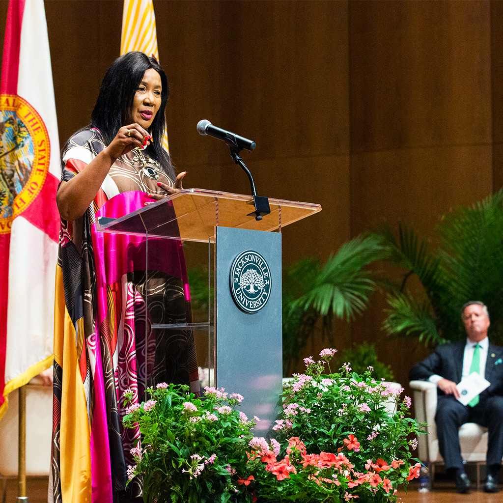 Dr. Makaziwe Mandela speaking at a podium