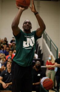 Dee Brown in a JU shirt shooting a basket