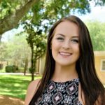 smiling brunette caucasian young female