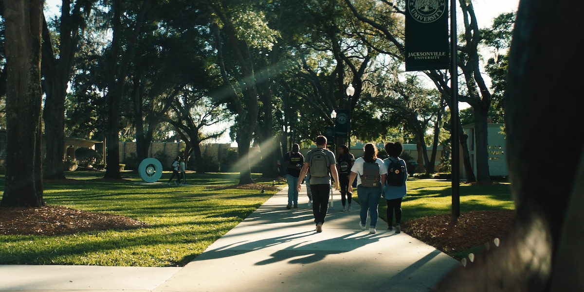 students walking through campus