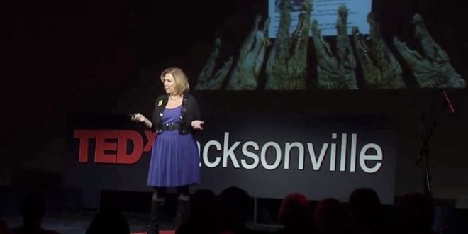 female speaker talking on stage