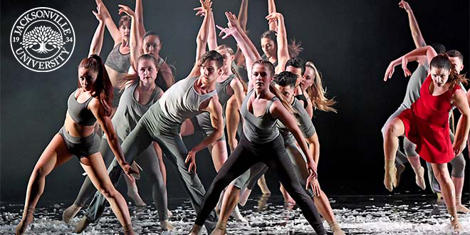 A group of student dancers performing on stage.