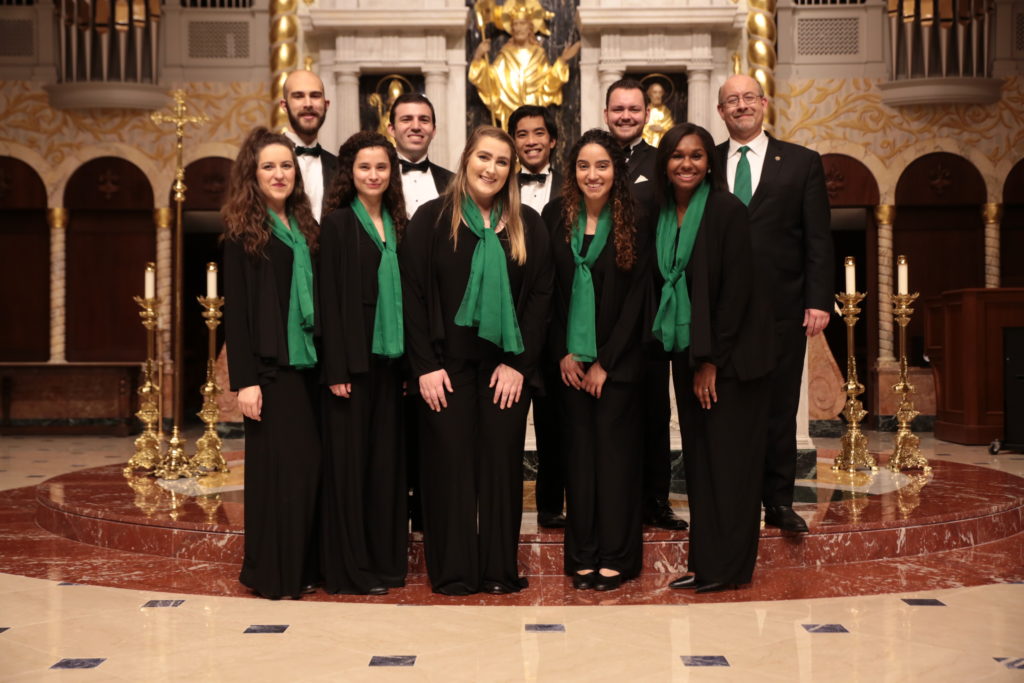 Dean Snyder with a chorus of students.