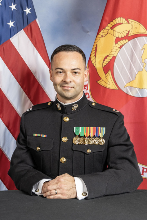 man in navy uniform and us flag