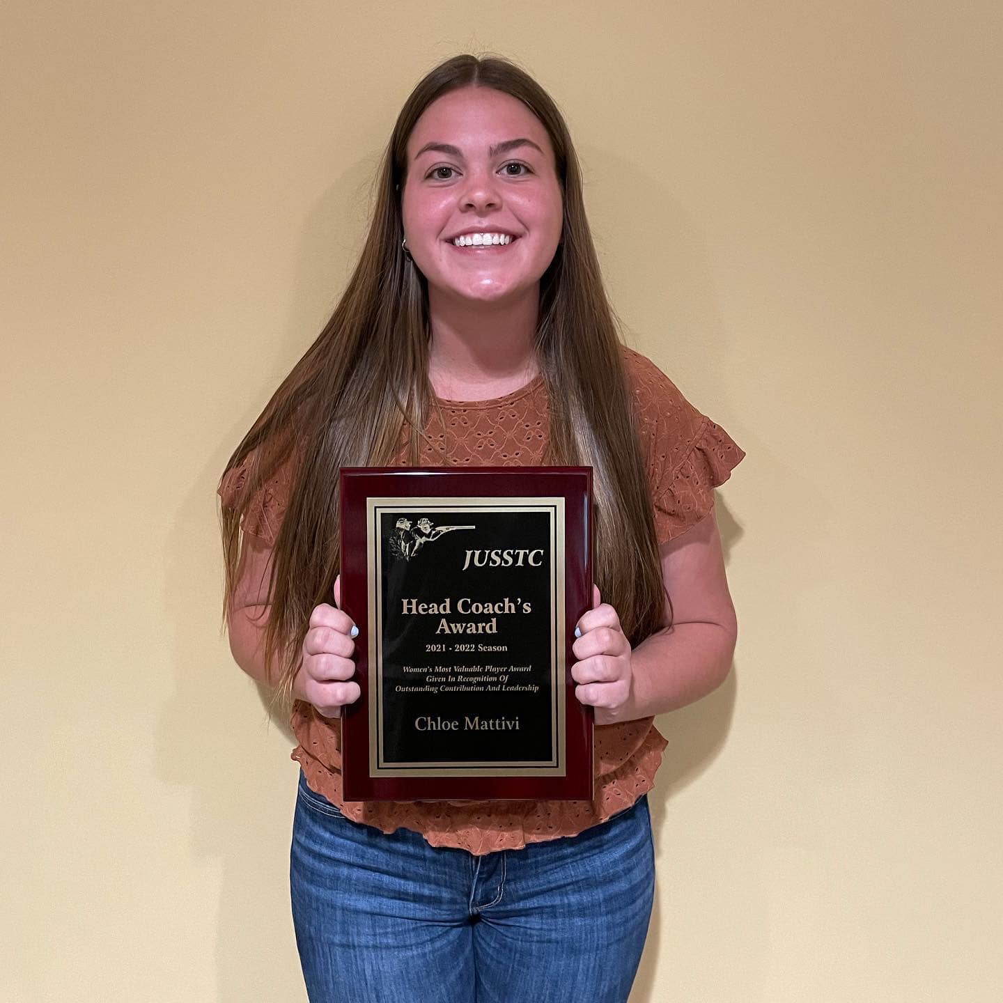 girl holding an award