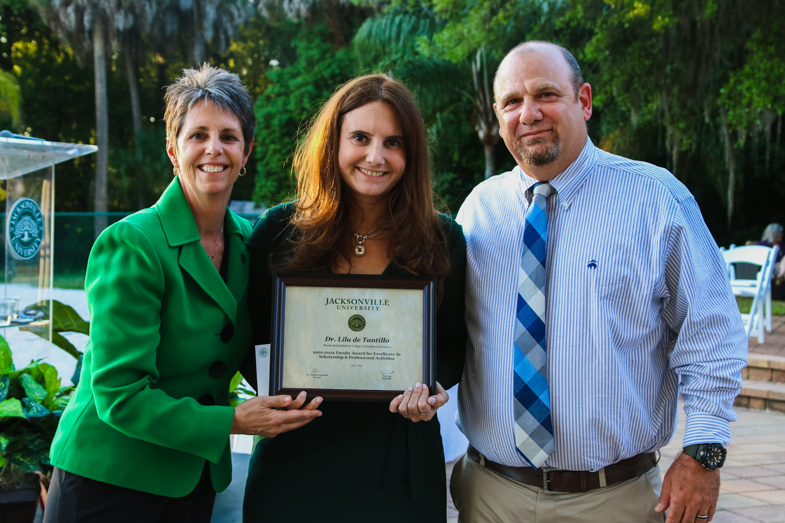 Dr. de Tantillo (middle) is recognized with the Faculty Excellence Award for Scholarship and Professional Activities. Photo by Taylor Sloan.