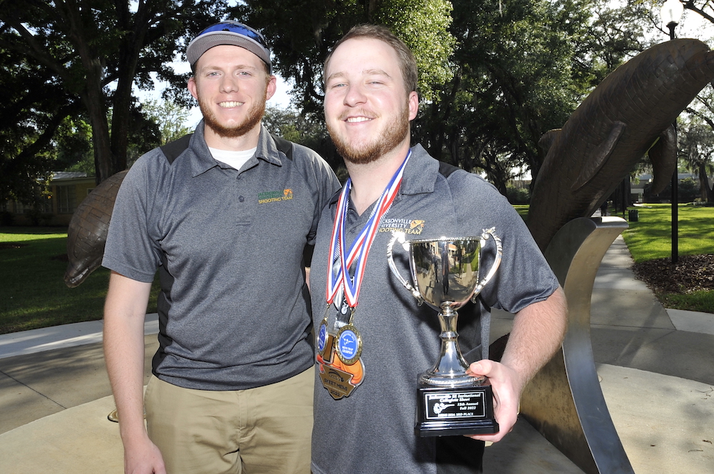 team members with trophy