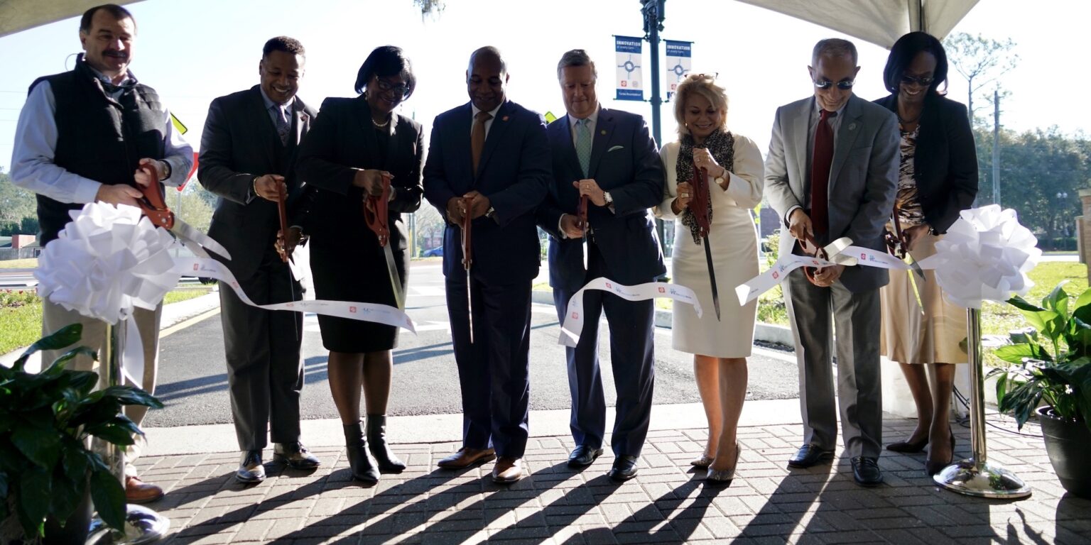 JTA CEO Nathaniel Ford and Jacksonville University President Tim Cost cut the ribbon to the roundabout alongside dignitaries.