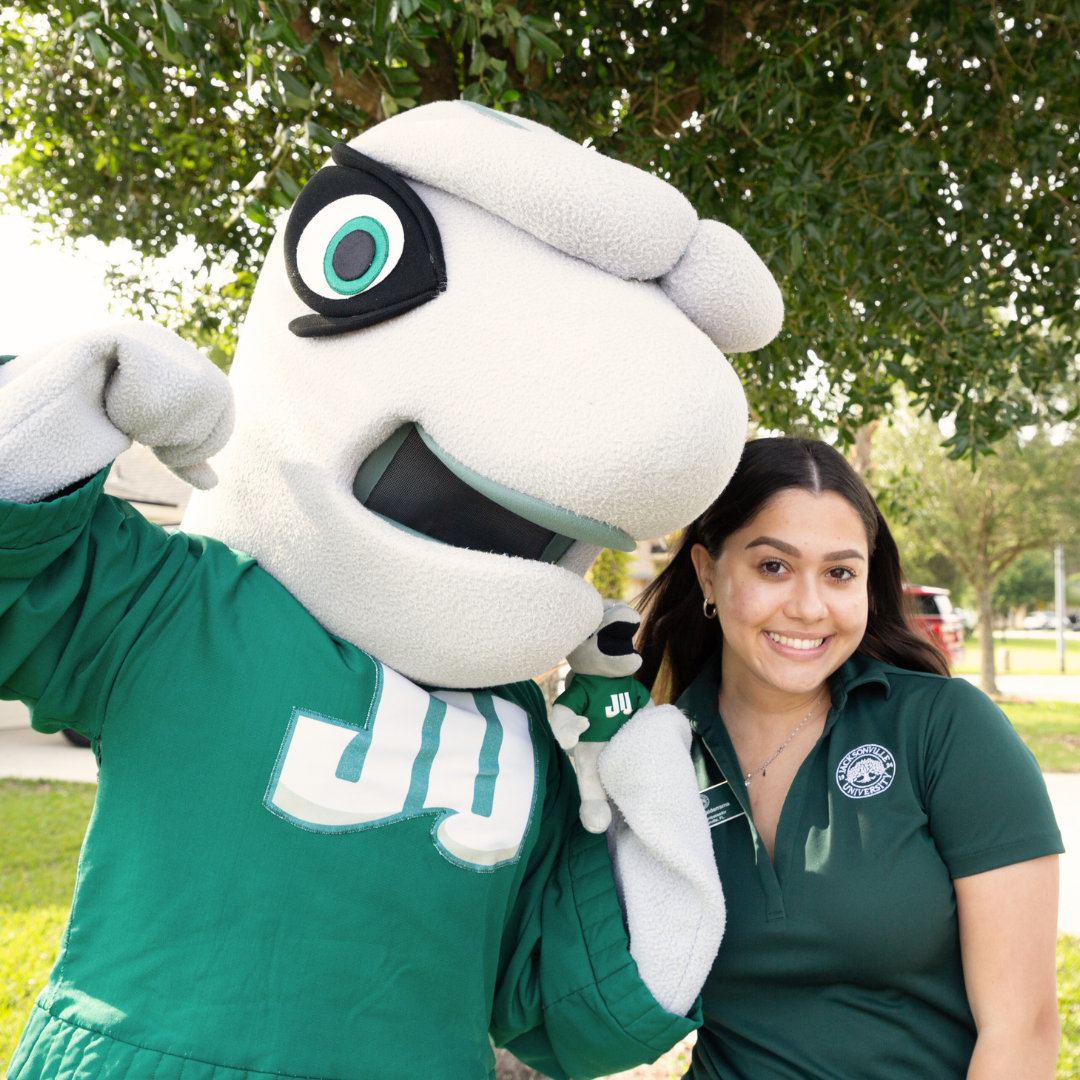 Smiling JU student with Dunkin, JU Mascot