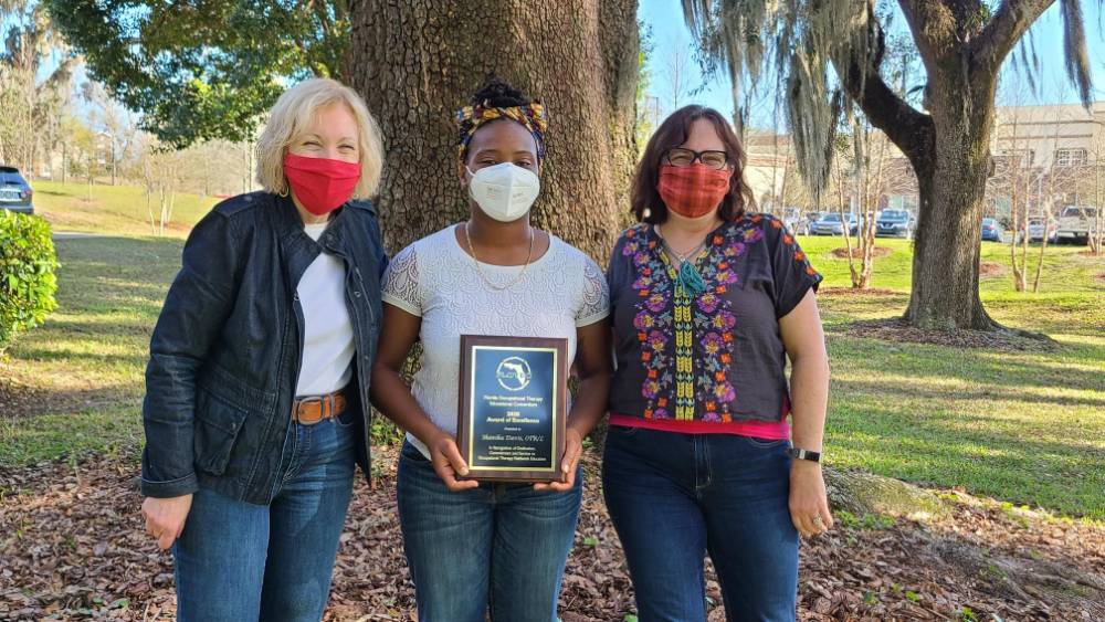 Shanika Davis winning an award in Field Work