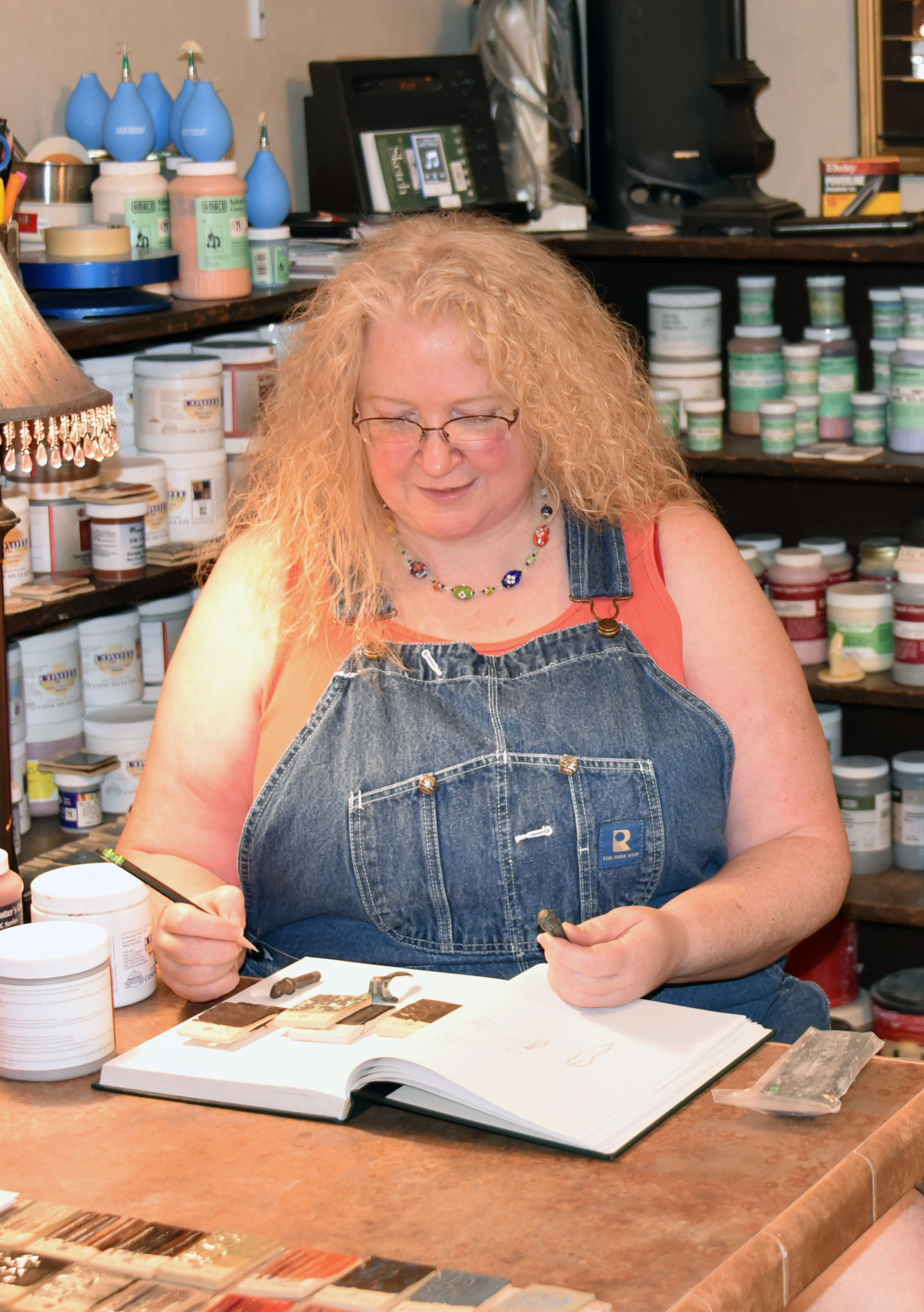 Dana Tupa sitting at her desk working 