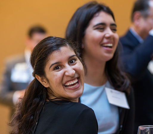 Student smiling at board meeting